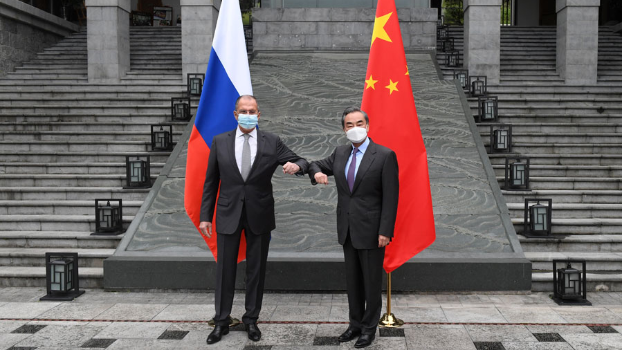 Chinese State Councilor and Foreign Minister Wang Yi (R) meets with Russian Foreign Minister Sergei Lavrov in the city of Guilin, March 23, 2021. 